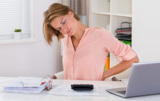 Young Woman Suffering From Backache