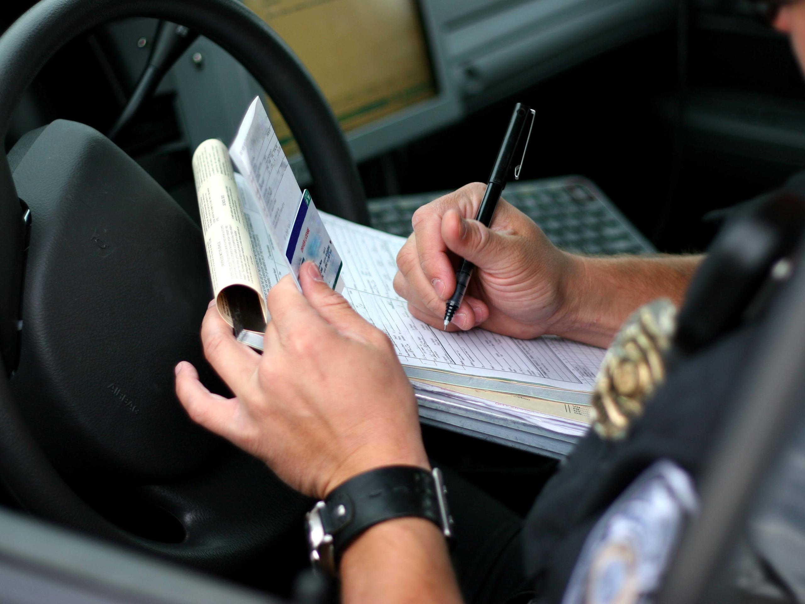 Police Officer Writing Ticket after a Car Accident