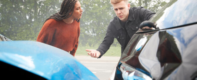 Two Angry Motorists Arguing Over Responsibility For Car Accident